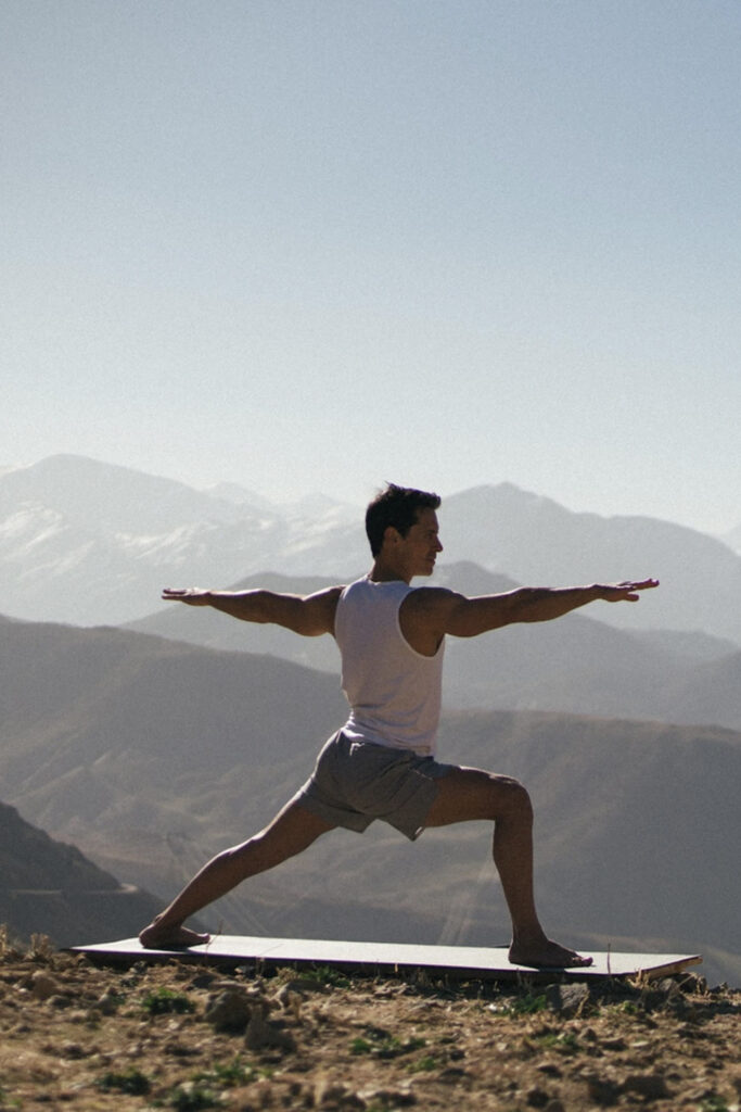 Nico doing yoga on the mountain